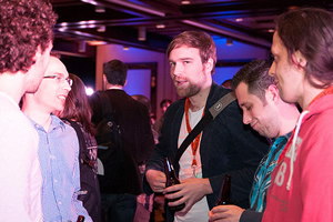 Group of people chatting at the cocktail.